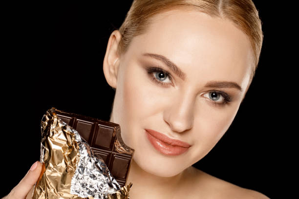 istock woman with chocolate bar 669566922