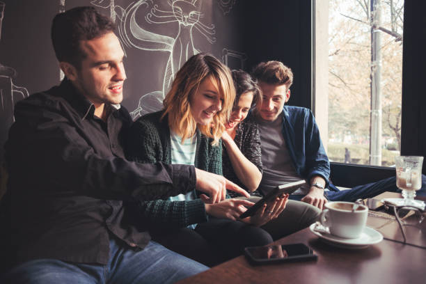 istock Group Of Friends Chatting Over Coffee 669566964