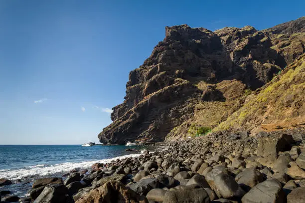 Lower point of Masca trekking path and excursion boats pier. Canary islands, Tenerife, Spain.