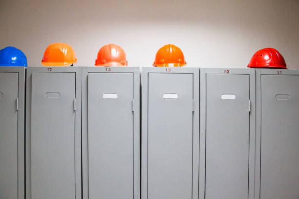 istock Metal lockers and plastic hard hats 669569404