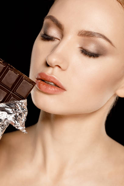 istock woman with chocolate bar 669569856