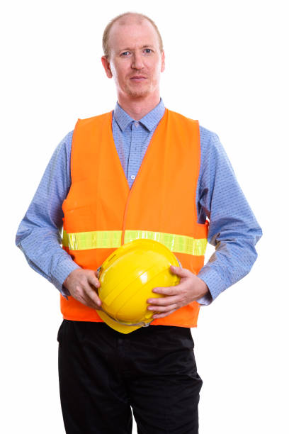 istock Studio shot of man construction worker holding safety helmet with both hands 669570016