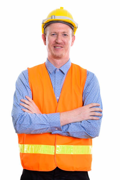 istock Studio shot of happy man construction worker smiling with arms crossed 669570084