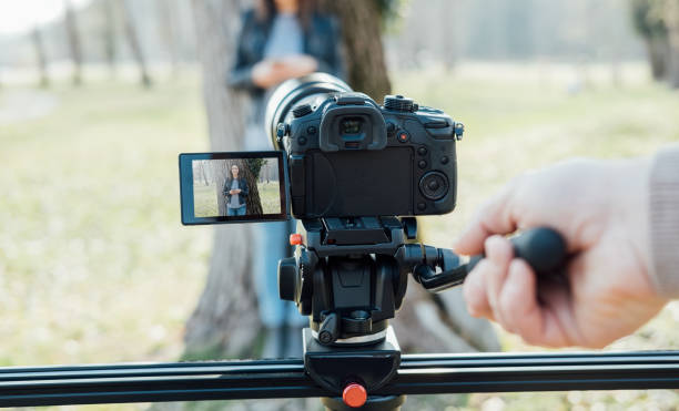 istock Video shooting at the park 669570394