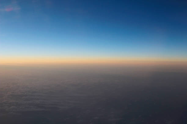 istock Amazing view from plane on the sky, sunset sun and clouds 669573282