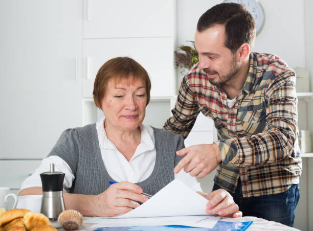 istock Woman signing agreement 669573570