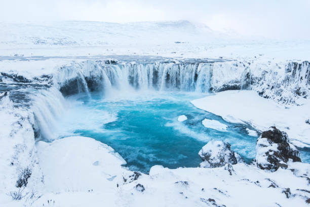 istock Beautiful winter Godafoss waterfall in Iceland, covered in snow, 669574772