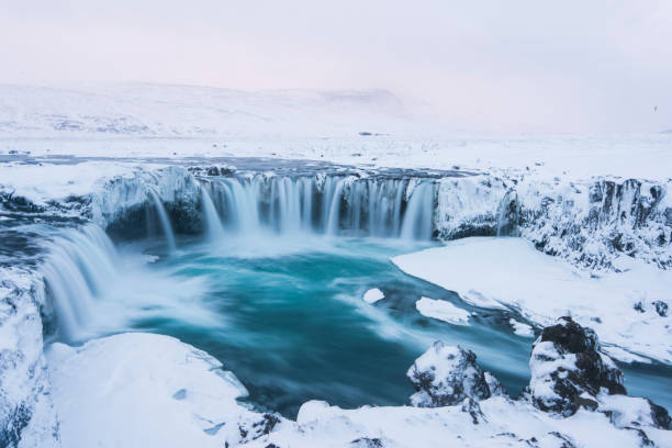 istock Beautiful winter Godafoss waterfall in Iceland, covered in snow, 669576924