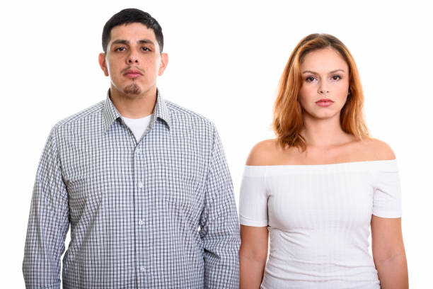 istock Studio shot of young couple looking at camera together 669577190