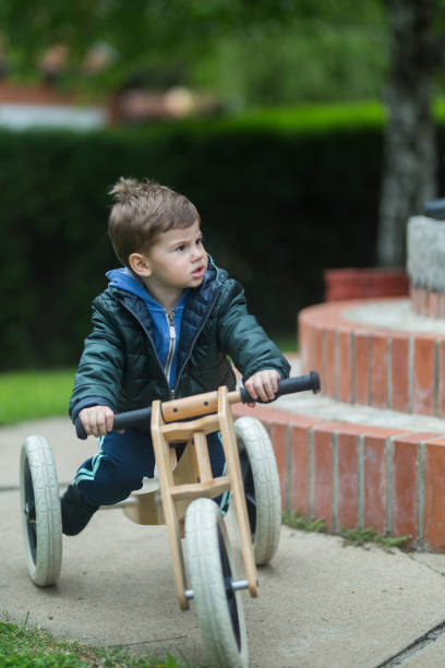 istock Riding a wooden bike 669577530