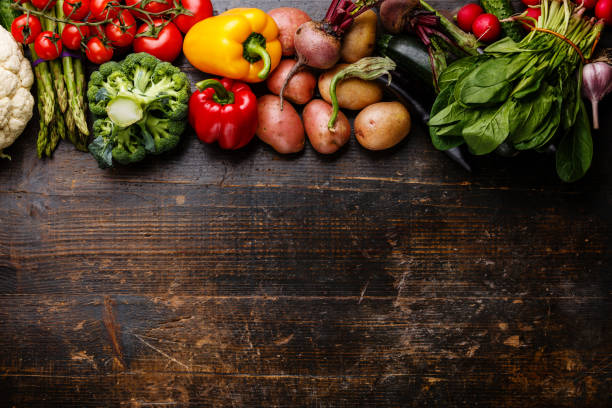 istock raw vegetables on wooden background 669580128