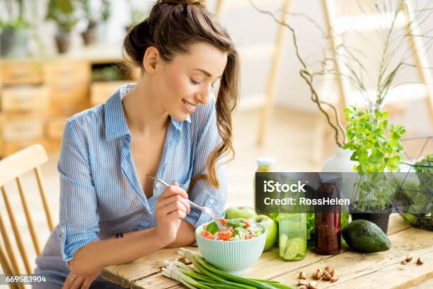 Woman Eating Healthy Salad Stock Photo - Download Image Now - Healthy Eating, Eating, Women