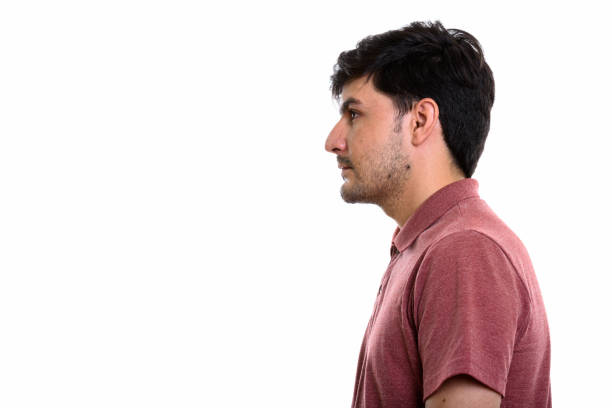 istock Profile view of young Persian man against white background 669587550