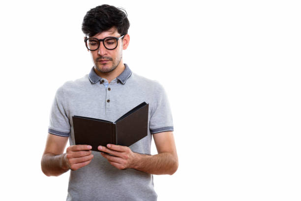 istock Studio shot of young Persian man reading book 669587958