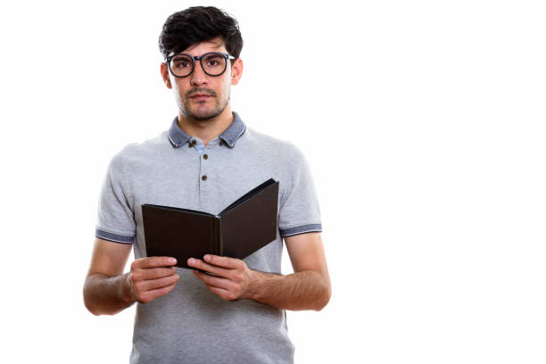istock Studio shot of young Persian man holding book 669588004