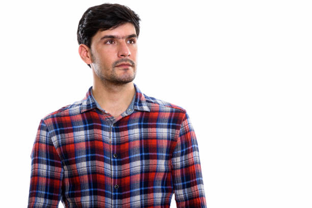 istock Studio shot of young Persian man thinking while looking up 669588170