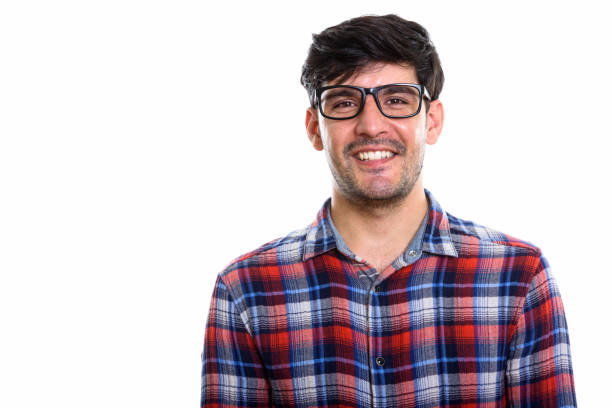 istock Studio shot of young happy Persian man smiling while wearing eyeglasses 669588444