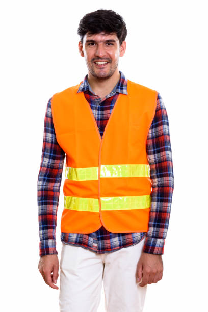 istock Studio shot of young happy Persian man construction worker smiling while standing 669588698