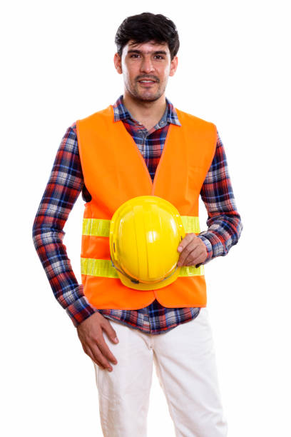 istock Studio shot of young Persian man construction worker standing while holding safety helmet 669588780