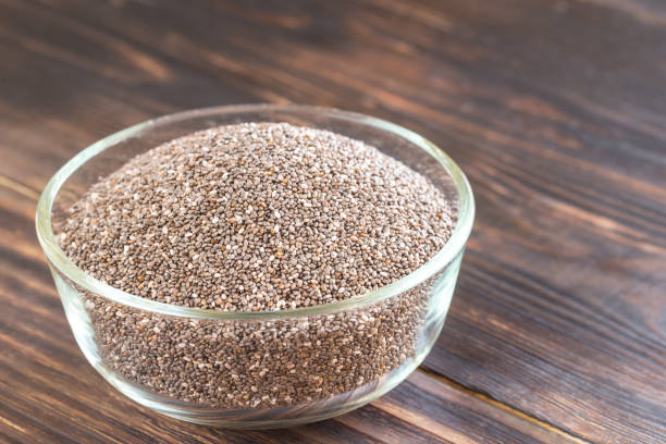 istock Glass bowl of chia seeds 669592286