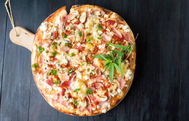 istock Happy pizza with marijuana leaves 669601034