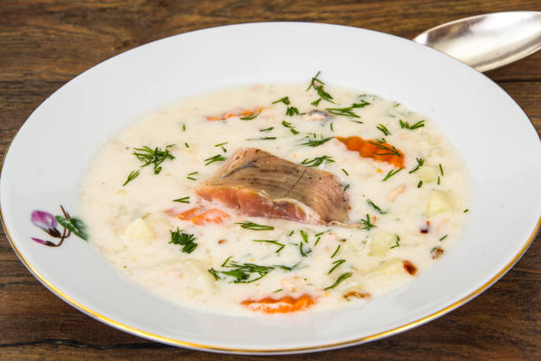 istock Milk cream soup with vegetables and trout 669606874