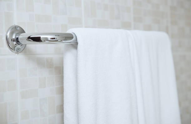 Towel drying on the rail in bathroom stock photo