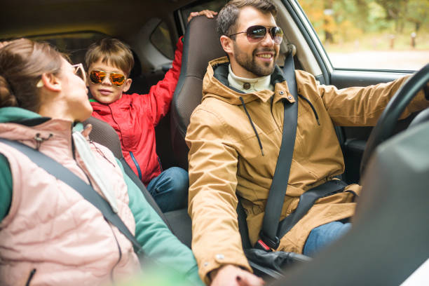 istock Happy family travelling by car 669610412