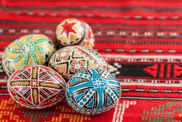 Photo of nicely decorated easter eggs on traditional rug