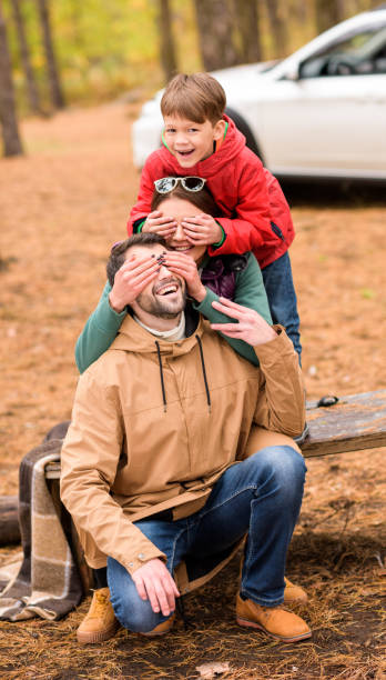 istock Happy family playing in autumn forest 669613190
