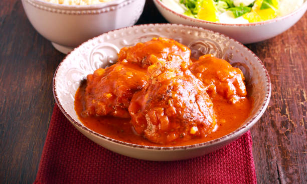 istock Chicken thighs in spicy tomato sauce 669613394