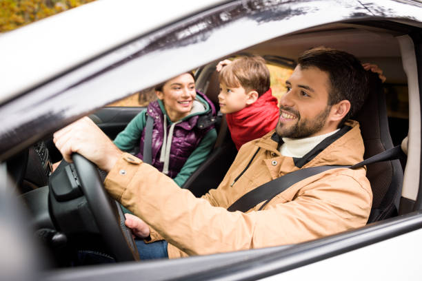 Happy family travelling by car