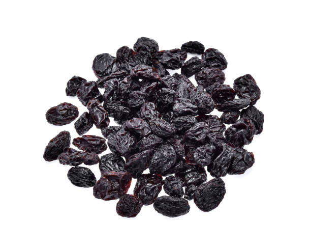 istock black raisins isolated on white background 669614572