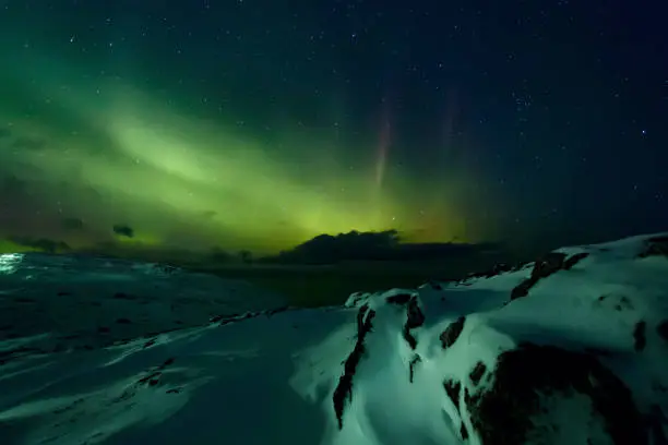Photo of Northern lights. Aurora borealis nature landscape at night