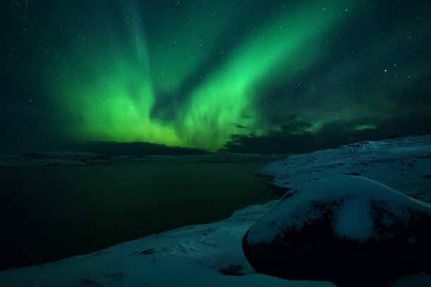 istock Northern lights. Aurora borealis nature landscape at night 669628476
