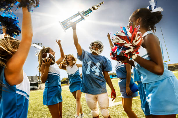 istock Football Cheerleaders & Player 669638604