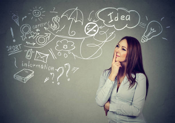 istock pensive young woman thinking has many ideas looking up 669638788