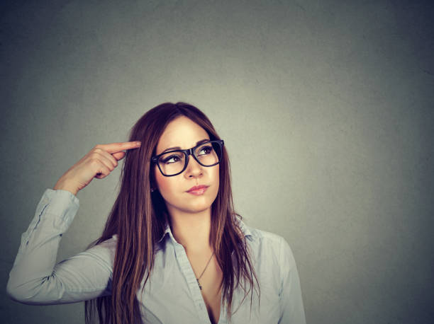 istock confused thinking woman bewildered scratching head seeks a solution looking up 669638808