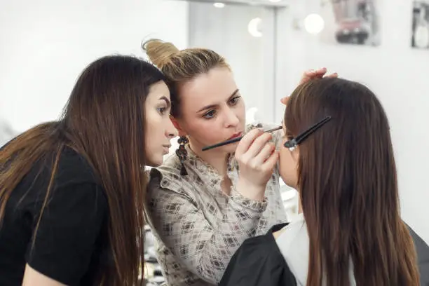 Photo of makeup artist working in studio