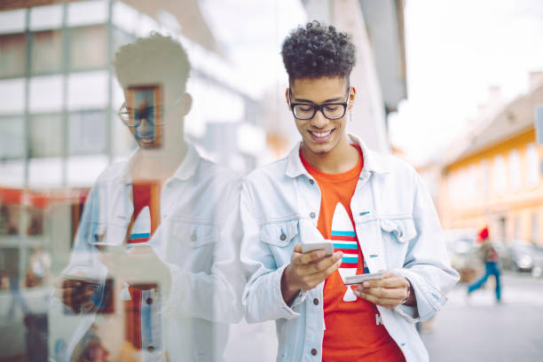 Young man using phone in the city