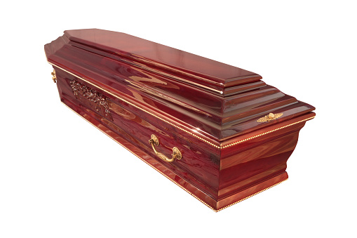 Wooden coffin isolated on black background. Funeral attributes. Funeral service