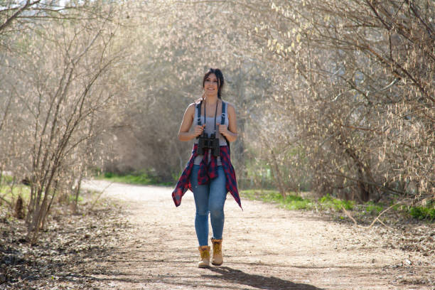 istock Young woman walking on the field 669645046