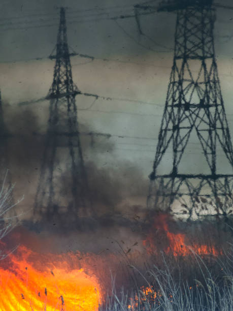 istock Fire in the field near high-voltage poles 669649298