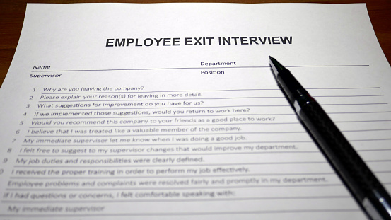 Someone filling out Employee Exit Interview.