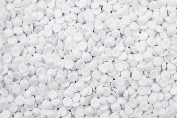 istock close up of white plastic polymer granules as background. 669652492