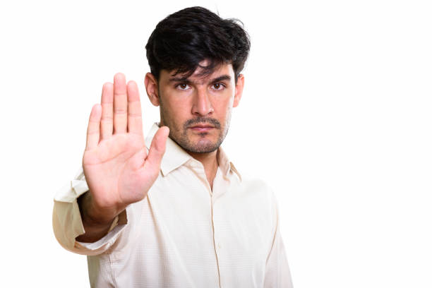istock Studio shot of young Persian businessman with stop hand gesture 669652902