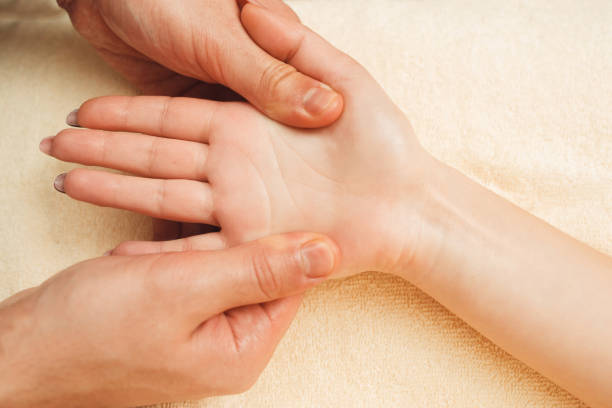 istock Female palm massaging flat lay closeup 669655982