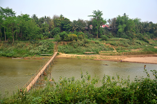 Bamboo bridge for people walk crossing mekong river in Luang Prabang, Laos