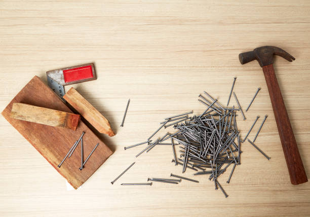 istock Hammer and nails on wood 669666176