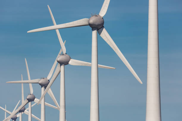istock Row of big wind turbines at sunny day 669667268